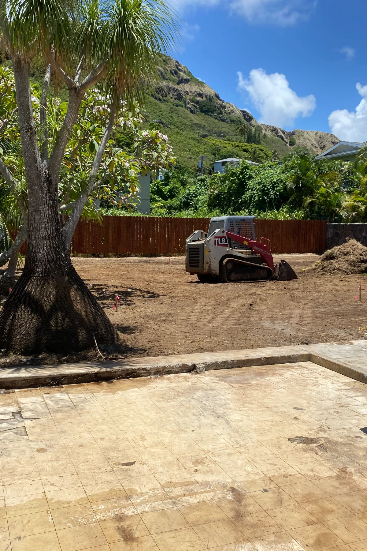 Excavation contractor operating heavy equipment on an Oahu construction site.